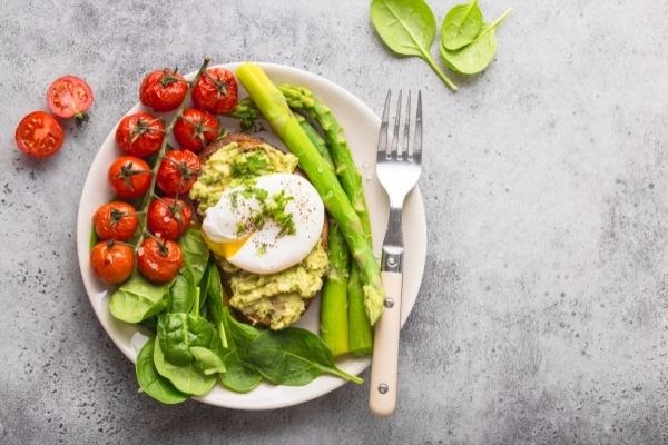 full plate of vegetables and fork